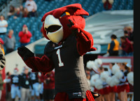 The winner of our 2013 Most Spirited contest runs on to the field with Hooter