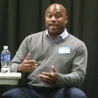 A journalist speaking at the summit