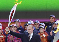 Vlaidmir Putin lighting the Olympic torch