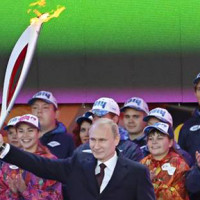 Vlaidmir Putin lighting the Olympic torch