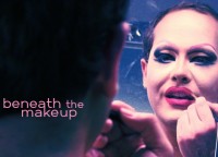 Pissy Miles applying makeup in the mirror