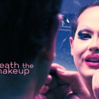 Pissy Miles applying makeup in the mirror