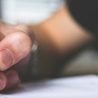 Person writing in a notebook