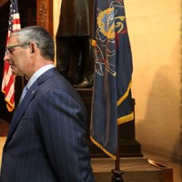 Around Lincoln’s lectern, Fred Stein (left) of the Creative Group and Bob Ciarruffoli (right) of World Meeting of Families 2015 talk with James Mundy of the Union League, where the historic piece is being kept while on loan , taken by philly.com's DAVID MAIALETTI