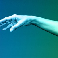Two hands reaching out to one another