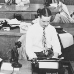 Journalists working at a desk